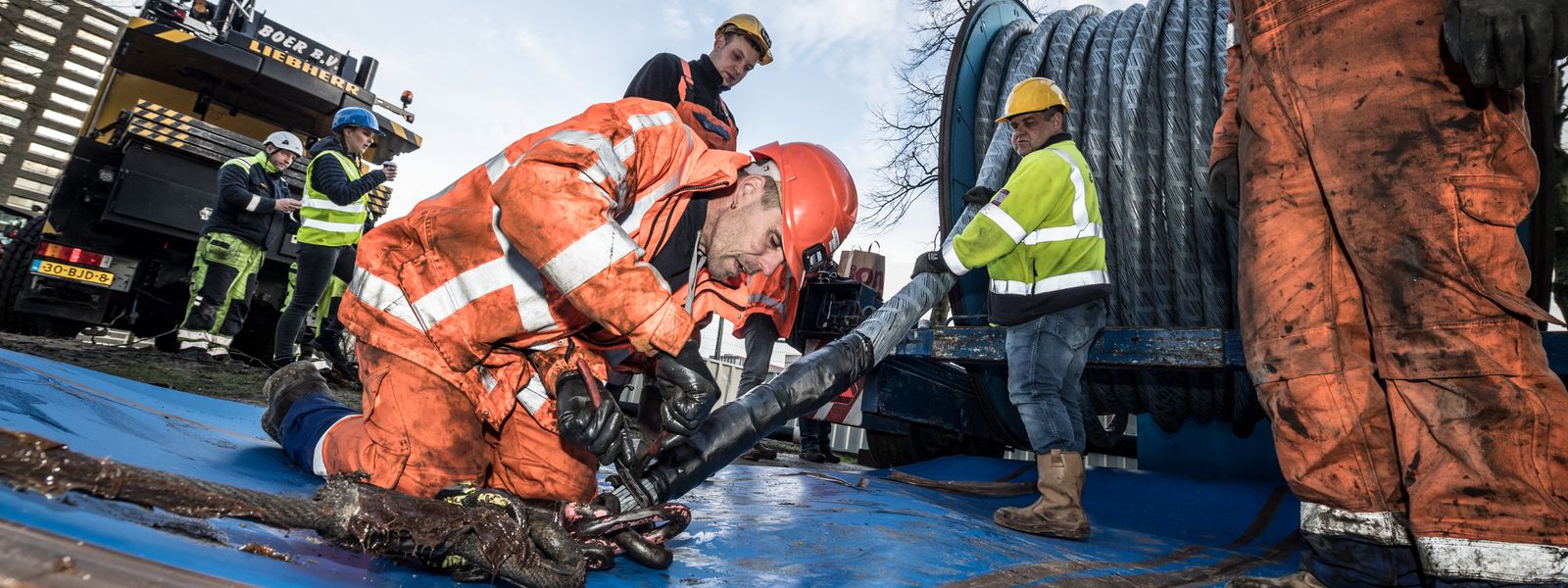 Cable installer preparing city cable to be installed on site in Amsterdam