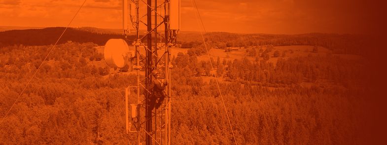 Cable installer carrying out an installation high in a telecom tower